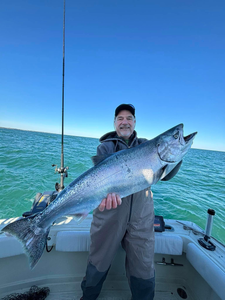 Angler with a beautiful rainbow trout caught in Olcott