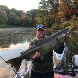 Angler with large 38-inch fish caught while fishing in Olcott