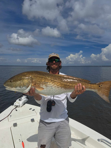 A photograph of a redfish measuring 40 inches, caught in Morehead City.