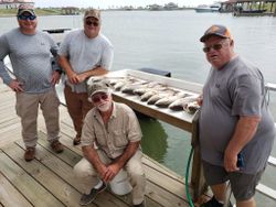 Four people fishing in Port O'Connor