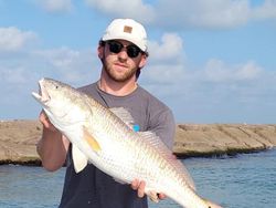 Angler with fishing rod in Port O'Connor