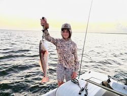 Angler with a fishing rod casting in Port O'Connor
