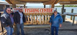 Eight redfish displayed at Port O'Connor TX fishing center cleaning station