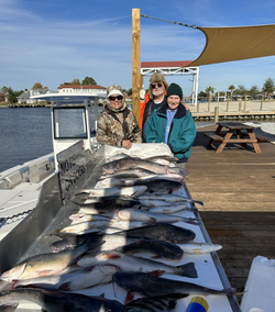 A group of 3 people enjoying a fishing trip in LA