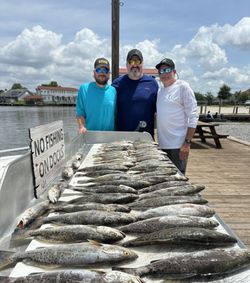 Three people fishing at Slidell