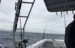 Fishing boat on ocean waters with fishing rods and equipment setup near Miami Beach FL