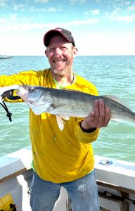 A person enjoying a cruise, fishing, or tour experience in Port Clinton