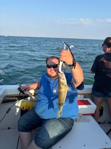 Freshly caught walleye held up on fishing charter boat in Port Clinton OH waters