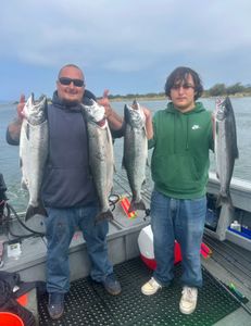 4 coho salmon and rainbow trout caught while fishing in OR