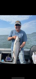 A single fisherman enjoying the picturesque Oregon scenery while fishing