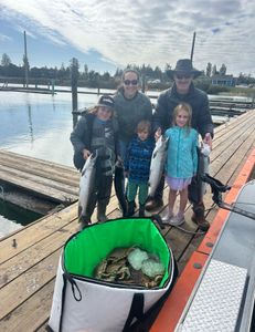 Two rainbow trout and coho salmon caught while fishing in OR