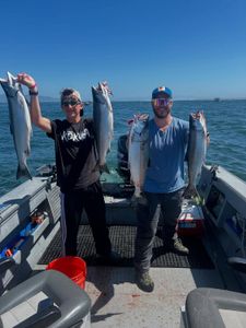 Four rainbow trout and coho salmon caught while fishing in OR
