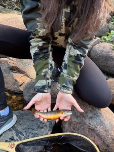 Brook trout caught while fishing in Newport PA, held over rocky stream