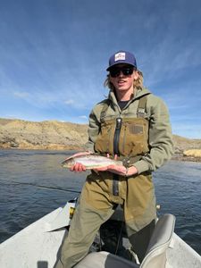 Angler holding freshly caught trout on boat in Newport PA