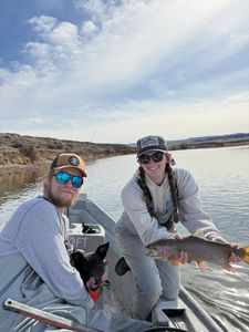 Fishing guide boat on lake in Newport PA with caught trout