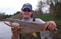 A skilled angler reels in a magnificent sea trout in MI