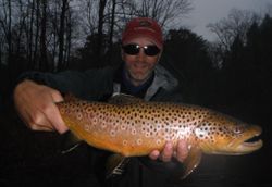 Angler with a sea trout measuring 23 inches in Baldwin