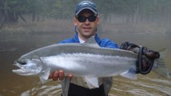 Angler with a rainbow trout catch in MI
