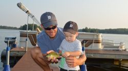 Two people fishing in MI