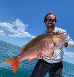 A person fishing on Miami Beach.