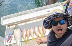 Fisherman with 5 fish caught in Miami Beach