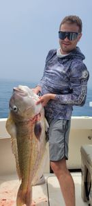 A single angler fishing in the waters of Cape May