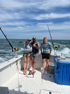 Three anglers enjoying a fishing trip in Maine