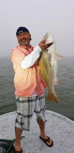 Angler holding a fishing rod in TX
