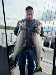 Two Coho Salmon, each measuring 29 inches, being caught while fishing in NY