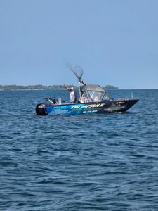A person fishing in Sackets Harbor