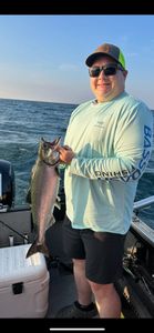 A person fishing in Sackets Harbor