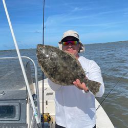 Angler with caught summer flounder fish in St. Marys