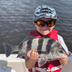Angler catches a black drum fish in St. Marys