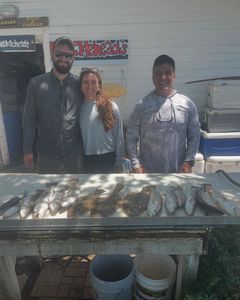 Three people fishing at St. Marys