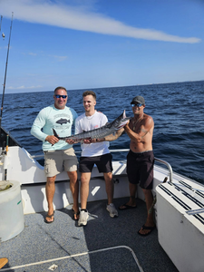 Three people fishing in Destin, Florida