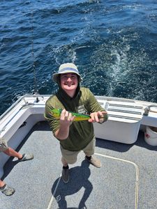 A person fishing in the waters of Destin