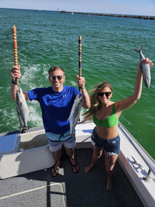 Two people fishing with Spanish Mackerel catch in Destin