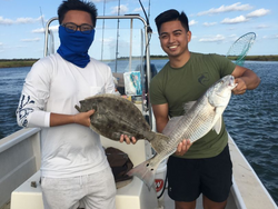 Two anglers fishing with rods in Morehead City