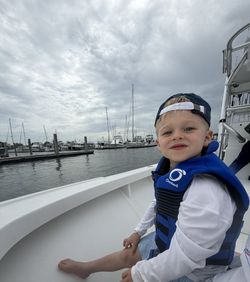 Young child on fishing boat at marina in Morehead City NC