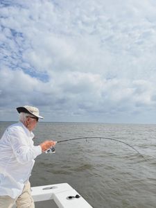 Fishing rod bent with catch from boat in Morehead City NC waters