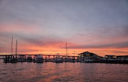 Marina at sunset in Morehead City NC with boats docked at pier