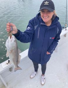 Angler holding a redfish in NC