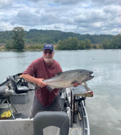 Angler holding a 22-inch fish in Chehalis