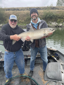 Two people fishing with one catch in Chehalis