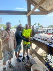 Three people on a fishing tour in Key Biscayne