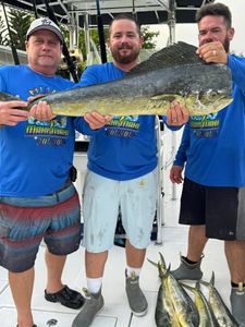 Three anglers fishing on the beach in Key Biscayne, Florida
