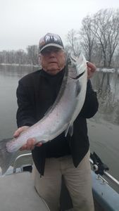 Angler with a 21-inch fish caught in Manistee