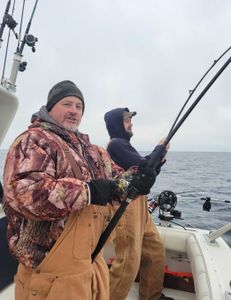 Two people fishing in MI
