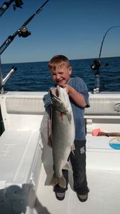 A lone angler fishing in Manistee
