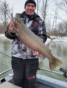 Angler with a beautiful rainbow trout caught in Manistee